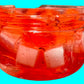 Clear container with red goo and white cubes