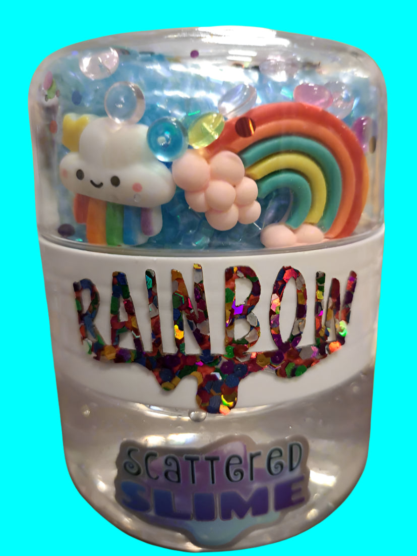 Jar of rainbow-themed slime with a cute cloud and rainbow figure on a blurred background